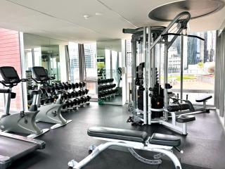 Compact Stay with Balcony, Rooftop & Gym - 3