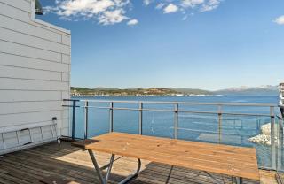 Arctic Waterfront Apartment Balcony & Views - 1
