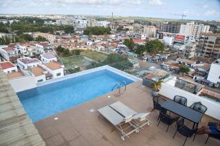 Charming 1BR with Rooftop Pool & Stunning City Views - 6