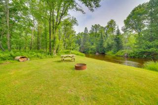 Fish, Hike & Relax: Riverfront Manistique Cabin - 8