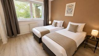 Apartment für Berufstätige mit 5 Einzelbetten, Smart TV, Küche, WIFI, Balkon, WaMa - 8