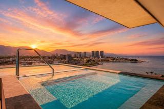 Ocean-view condo in Puerto Vallarta with rooftop pool, fitness room, and balcony - 8