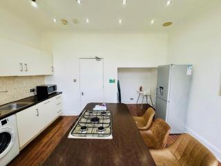 Spacious 4-Bed Duplex with Pool Table Near GLA Airport - 1