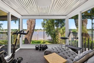 Premium waterfront home with hot tub & scenic views - 7