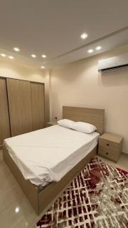 Spacious 3-Bedroom Furnished Apartment with Private Entrance in 6th of October - 6
