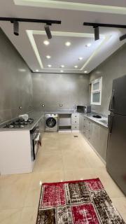 Spacious 3-Bedroom Furnished Apartment with Private Entrance in 6th of October - 2