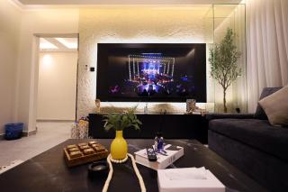 Apartment with an elegant lounge, smart entry, and a 75-inch 4K QLED TV - 8