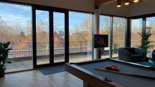 Penthouse with Pool Table and Balcony - 0