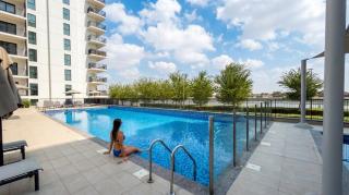 Vogue Vacation Homes, ABD Water's Edge, in the Heart of Yas Island, Three Bedroom plus Kids room Apartment with Balcony and Vibrant Community View, short driving distance from Ferrari World, Warner Bros, Water World and Grand Prix Formula 1 - 0
