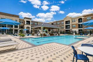 Modern 2BR Retreat with Pool, Gym and Balcony - 1