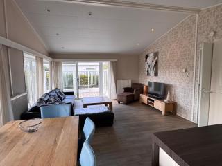 EuroParcs Schoneveld Breskens Chalet Meer und Sonne mit Zaun Haus Nr J253 - 6