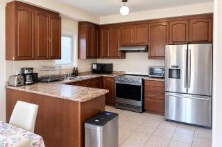 Private King Bedroom with TV, Mini Fridge, Workspace & Dresser in Brampton Shared Home - 3 Baths, Full Kitchen, WiFi, Laundry & Deck - Near GO Station, Ideal for Work & Couples! - 5