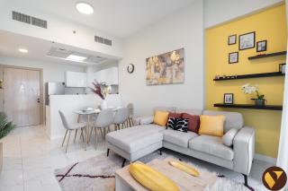 Vogue Vacation Homes, Alexis Tower Jabal Ali Walkable to Metro Station, near Expo City Dubai, One Bedroom Apartment with Balcony, Pool and Vibrant Community View, Access to all Amenities - 1