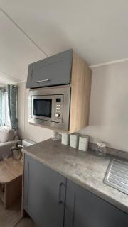 Homely 8 berth caravan with front decking at New Beach in Kent ref 66654NB - 2