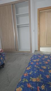 A one-bedroom apartment with a living room, kitchen, and balcony - 6