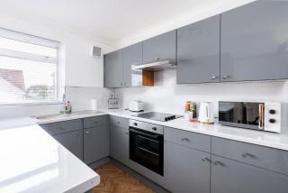 Chic 3BR Home with Balcony & Free Parking - 8