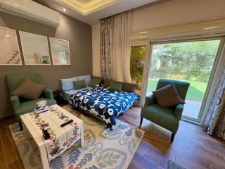 Top-rated 1BR with Private Garden in Compound - only families & single travelers - 2