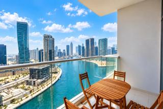 Vogue Vacation Homes, Business Bay Damac Maison Prive near Burj Khalifa and Dubai Mall, One Bedroom Apartment with Balcony, Canal and City Skyline View, Access to all Amenities - 9