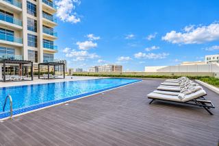 Vogue Vacation Homes, Arjan Jwelz by Danube near Miracle and Butterfly Garden, Studio Apartment with Balcony and Vibrant Community View, Access to all Amenities - 0