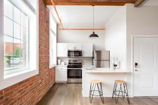 Jennifer's Historic Loft Glass Bedroom - 9