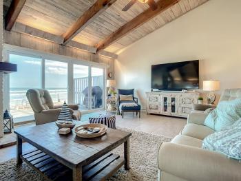 Beachfront Deck with steps down to the white sandy beach Sea Dunes Sandcastle 1A, Edgewater (photo 3)