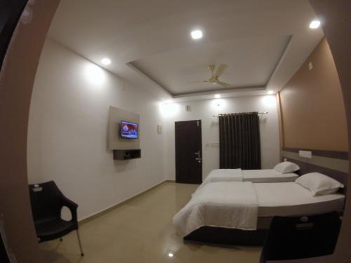 Alfa Inn Alfa Inn is conveniently located in the popular Kochi Airport area. The property features a wide range of facilities to make your stay a pleasant experience. Service-minded staff will welcome and guid