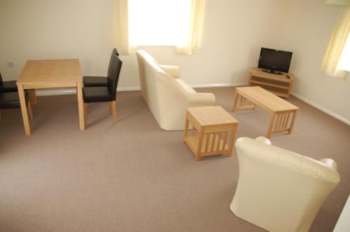 Közös társalgó / TV, Warrens Village Motel and Self Catering in Clevedon