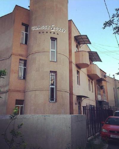 a building with a sign on the side of it, Classy&Cozy Hostel in Yerevan