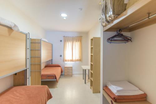 Single Bed in Dormitory Room