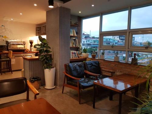 White Windmill Guesthouse White Windmill Guesthouse is a popular choice amongst travelers in Mokpo-si, whether exploring or just passing through. The property has everything you need for a comfortable stay. Service-minded staf