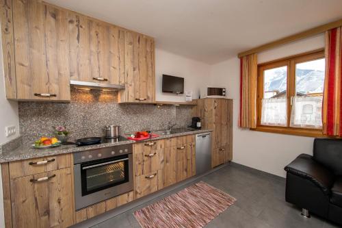 주방, Apartmenthaus Gotthardt in 카프룬