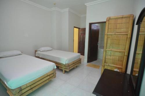 Puri Itoma Bungalows – Praya, ID
