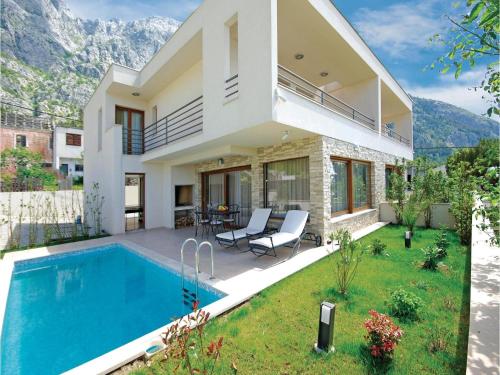  Three-Bedroom Holiday home Makarska with Sea view 07 in 21300 Makarska