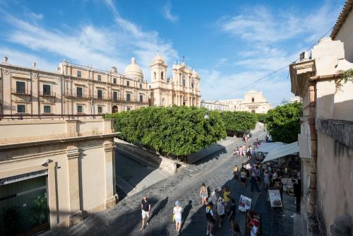 San Carlo Suites San Carlo Suites is perfectly located for both business and leisure guests in Noto. The property has everything you need for a comfortable stay. Service-minded staff will welcome and guide you at San 