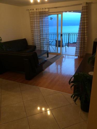 Three-Bedroom Apartment with Terrace and Sea View room in Apartments with a parking space Stanici Omis - 12312