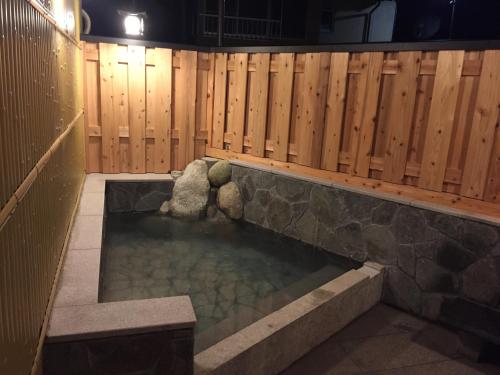 Hot spring bath, J-Hoppers Kumano Yunomine Guesthouse in Tanabe