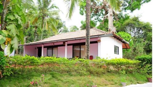 a house that has a tree in front of it, Simply Coorg Estate Villa in Coorg