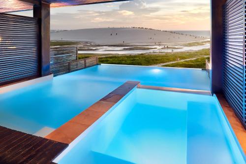 Habitación doble con piscina privada y bañera de hidromasaje con vistas al océano - Planta baja