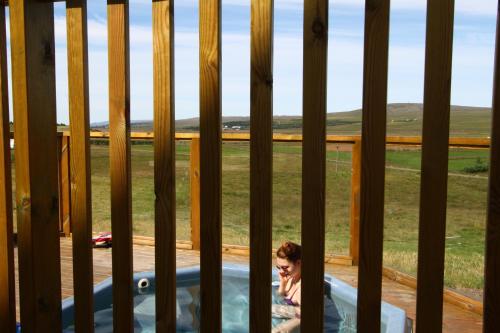Hot spring bath, Guesthouse Steindorsstadir, West Iceland in Reykholt