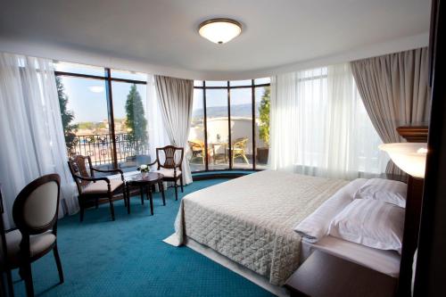 Aleksandrovski Grand Hotel Ideally located in the prime touristic area of Vladikavkaz, Aleksandrovskiy Grand Hotel promises a relaxing and wonderful visit. The property features a wide range of facilities to make your stay a pl