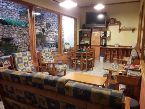 Közös társalgó / TV, Hostal Casa Barcelo in Horta De Sant Joan