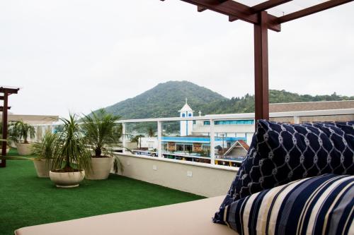 ระเบียง/ชานเรือน, Pousada Villa Di Enzo in ปรายา โด อิตากวา