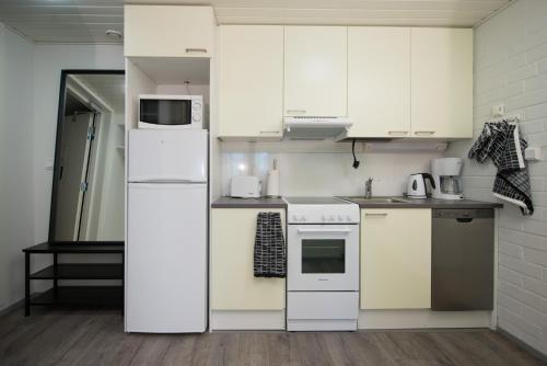 Kitchen, Innotelli Apartments in Kurkimäki