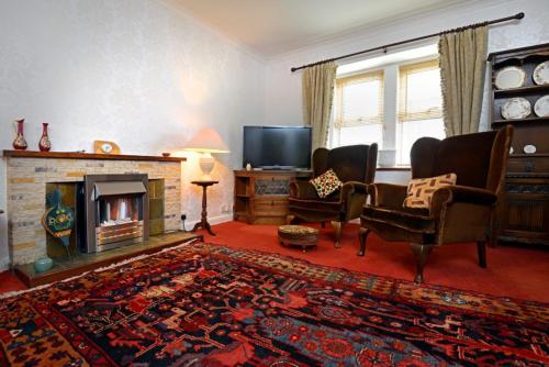 Shared lounge/TV area, Granny’s Cottage in Newcastleton