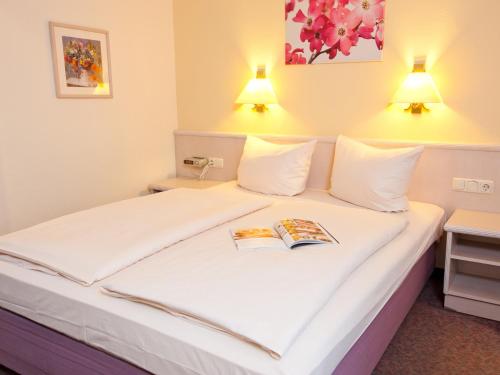 Hoteltraube Rudesheim The 4-star Hoteltraube Rüdesheim offers comfort and convenience whether youre on business or holiday in Rudesheim am Rhein. The property features a wide range of facilities to make your stay a pleas