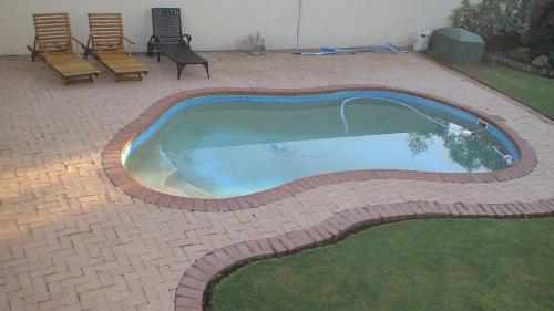 Swimming pool, Black Swan Guesthouse in Maseru
