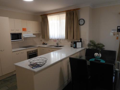Kitchen, Beaches Serviced Apartments in Nelson Bay