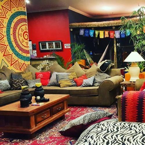 a living room filled with furniture and decor, Sensayuma Backpackers in Tugela Mouth