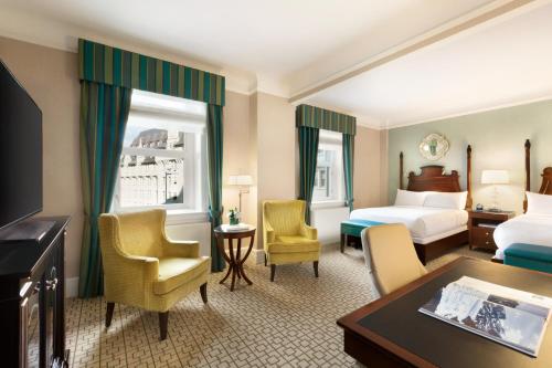 Deluxe 2 Doubles Larger Room with Courtyard Views