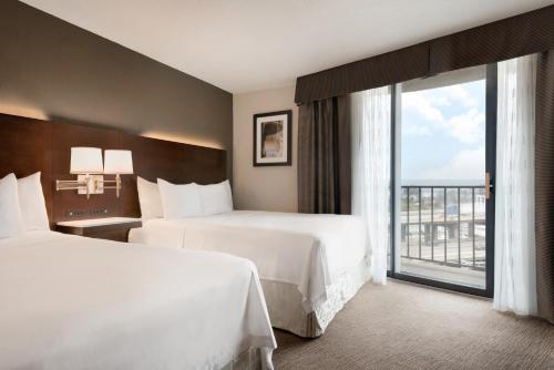 Queen Guest Room with Two Queen Beds with Balcony - Non-Smoking